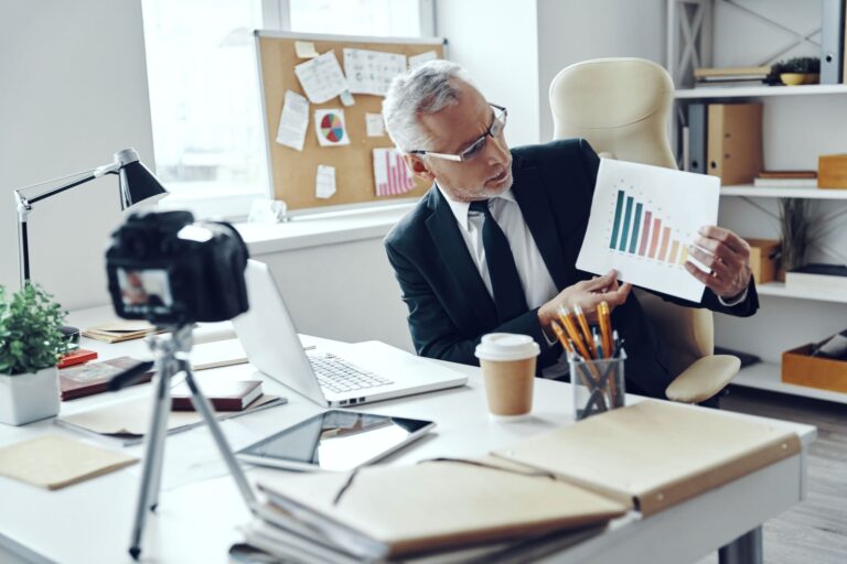 senior-man-in-elegant-business-suit-showing-chart-2025-02-21-22-43-24-utc (1)
